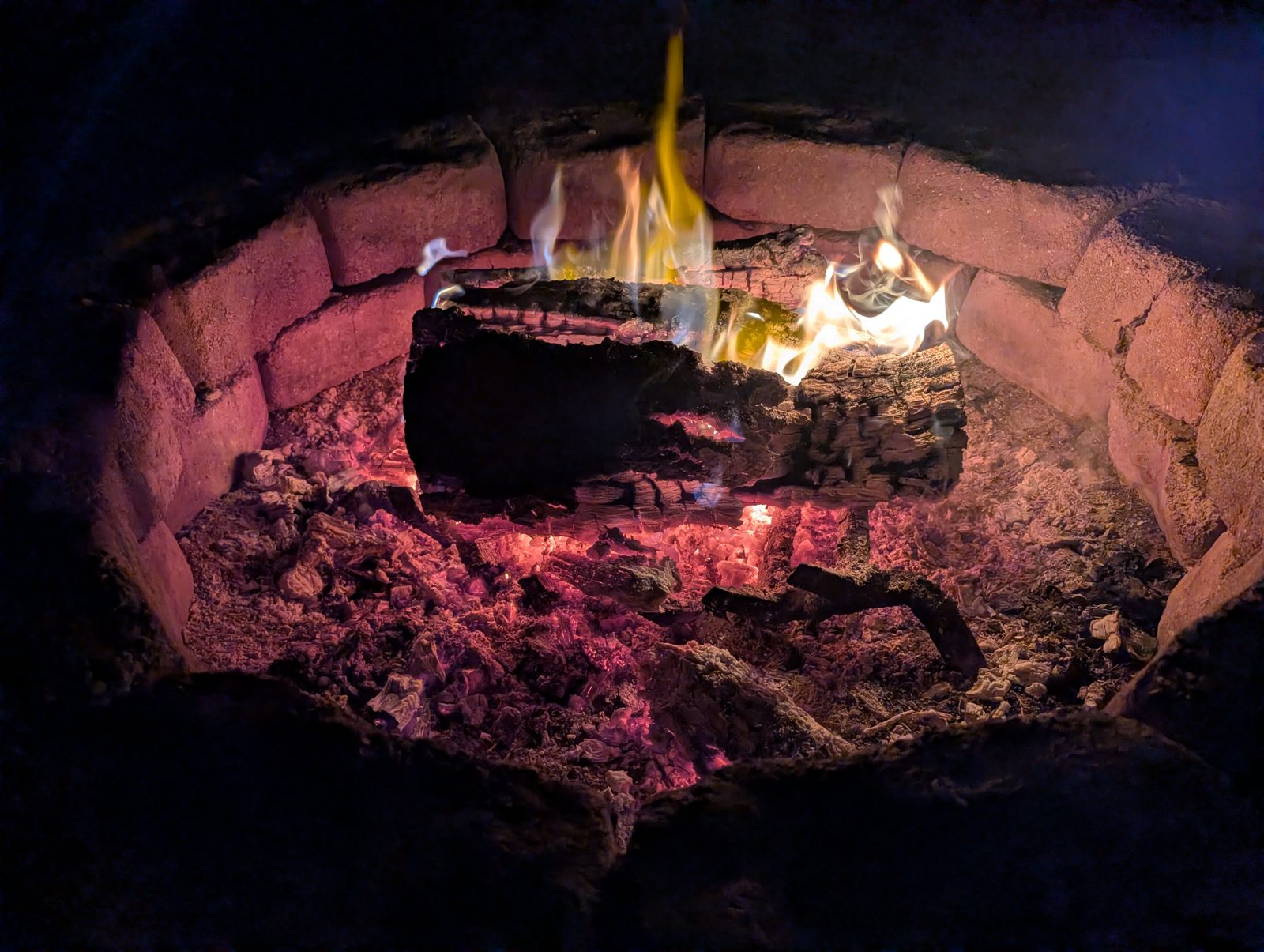 Embers in the stone fire pit